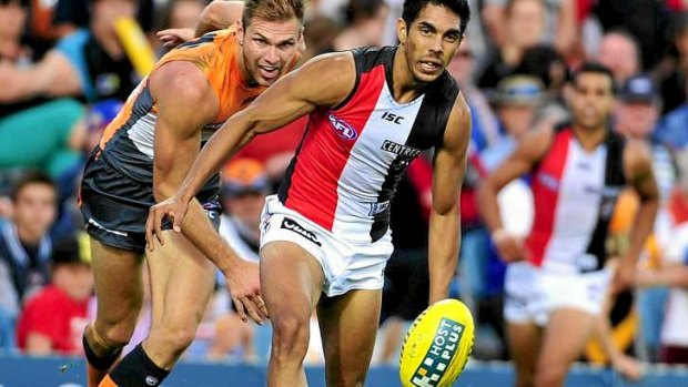 ''We're slowly getting there'': Stephen Gilham chases down St Kilda's Terry Milera.