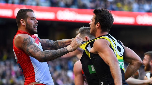Shirt front: Lance Franklin tussles with Richmond's Alex Rance. 