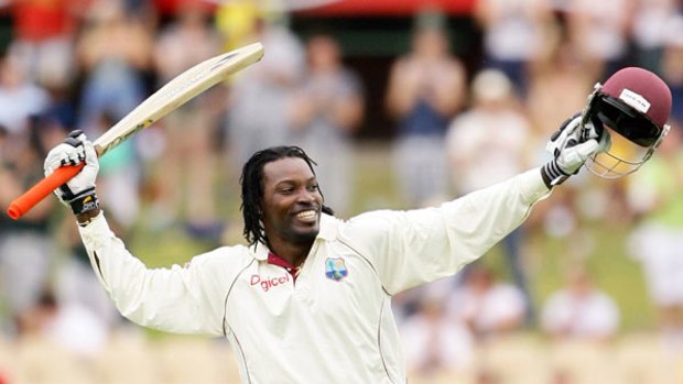 Gayle force ... West Indies captain Chris Gayle celebrates his century compiled with an array of fine strokes.