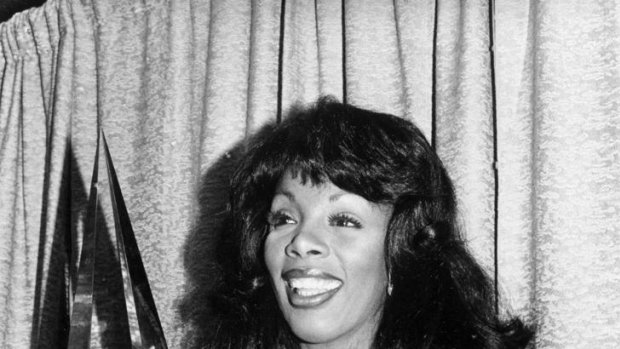 Donna Summer poses with three awards she won at the American Music Awards in 1979.