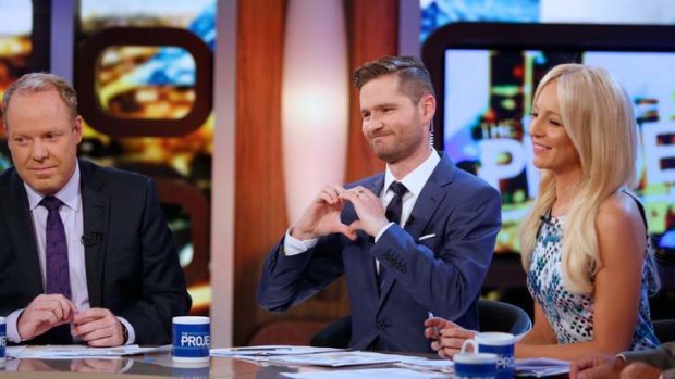 Charlie Pickering (centre) shares the love with Peter Helliar and Carrie Bickmore during his last turn as co-host of <i>The Project</i>.