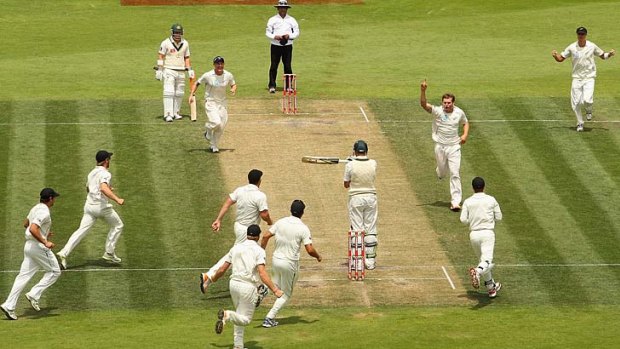 Doug Bracewell of New Zealand gets the wicket of James Pattinson of Australia on day four of the second Test at Bellerive Oval in December 2011. Bracewell took six wickets as New Zealand pulled off a seven-run victory.