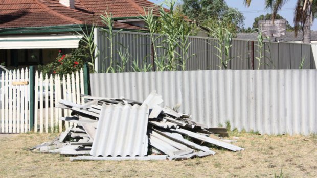 The asbestos was left on the verge for two months before the woman moved it back into her backyard.