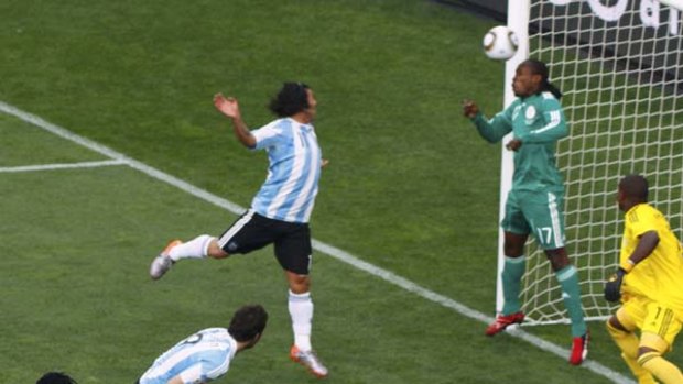Nigeria's goalkeeper Vincent Enyeama stands helpless as Gabriel Heinze's bullet-like header finds the net.