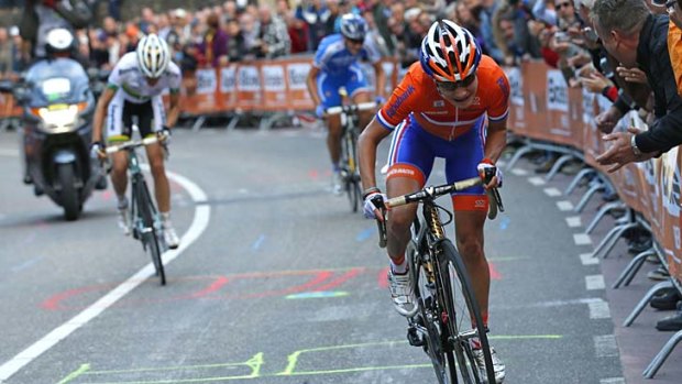 Race favourite Marianne Vos of The Netherlands surges ahead of Rachael Neylan (L) up the final climb.