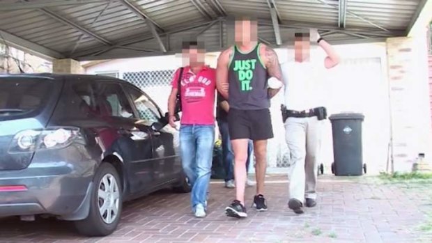 Police arrest an outlaw motorcycle gang member on the Gold Coast on Saturday.