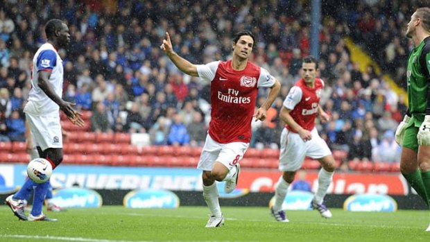 Arsenal's Mikel Arteta third from right) celebrates after scoring during the English Premier League tie against Blackburn Rovers.
