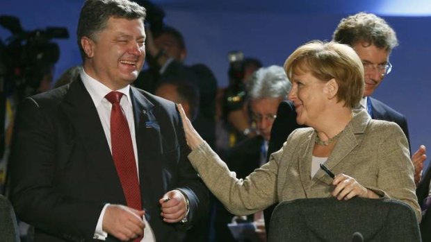 All smiles: German Chancellor Angela Merkel with Poroshenko.
