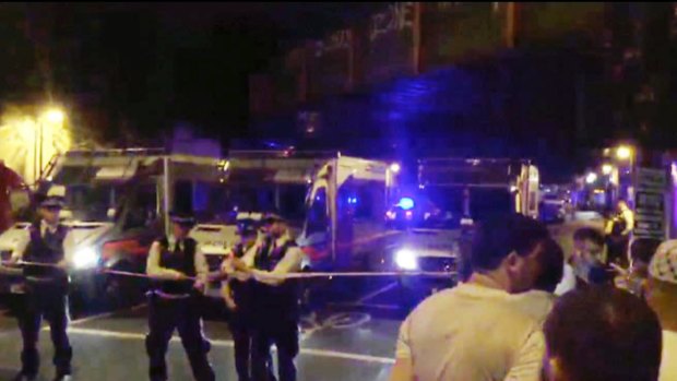 Police officers cordon off the area after a vehicle struck pedestrians near the Finsbury Park Mosque in London on Monday.