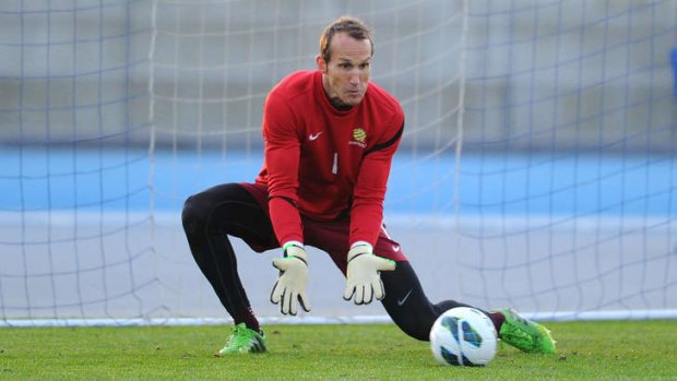 Eyes on the ball: Mark Schwarzer goes through his paces before Tuesday's clash against Iraq in Sydney.