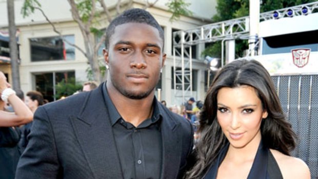 Too raunchy ... Kim Kardashian and former fiance Reggie Bush.