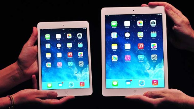 Apple's new iPad mini with Retina display, left, with the larger iPad Air.