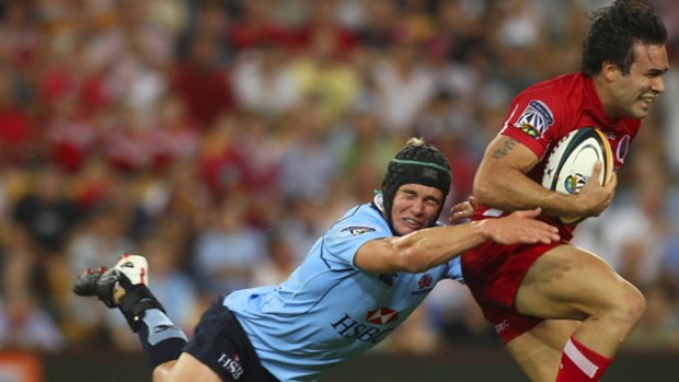 Close call . . . the Waratahs just held on to beat the Reds in the opening round.