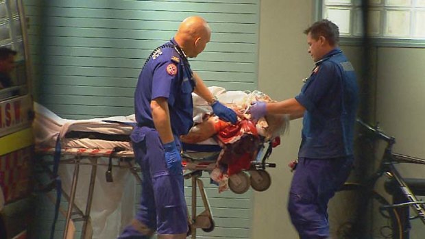 Induced coma: Paramedics take the driver to hospital.