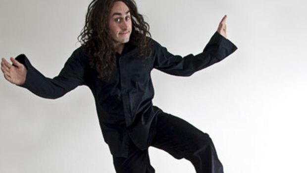 Comedian Ross Noble jumping.
