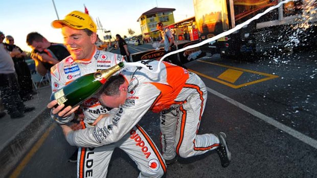 Drinks after driving &#8230; Craig Lowndes celebrates winning the opening race at Ipswich yesterday.