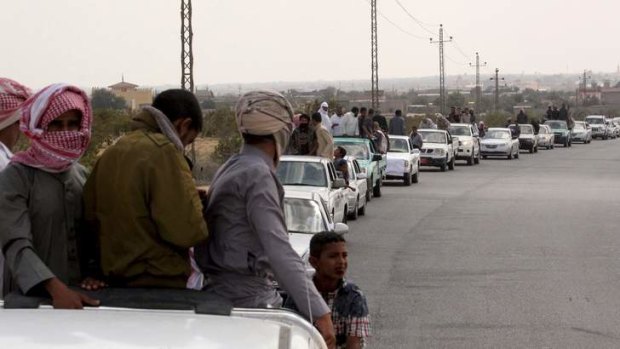 A funeral convoy carrying the bodies of four Islamist militants drives through Sheikh Zuweid, in the north of the Sinai peninsula.