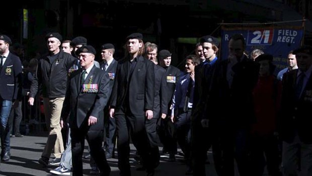 Anzac Day parade ... current and former servicemen and women march down George Street in Sydney.