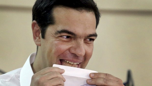 Greek Prime Minister Alexis Tsipras votes at a polling station in Athens on Sunday.  