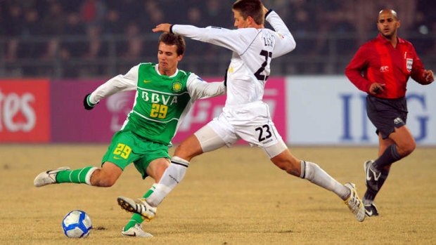 Homeward bound ... Joel Griffiths in action for Beijing Guoan against Melbourne Victory in the Asian Champions League in 2010.