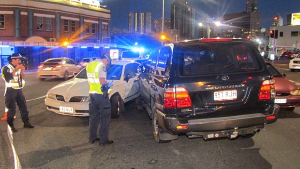 Investigators at the scene of the five car pile-up in Fortitude Valley following the police chase.