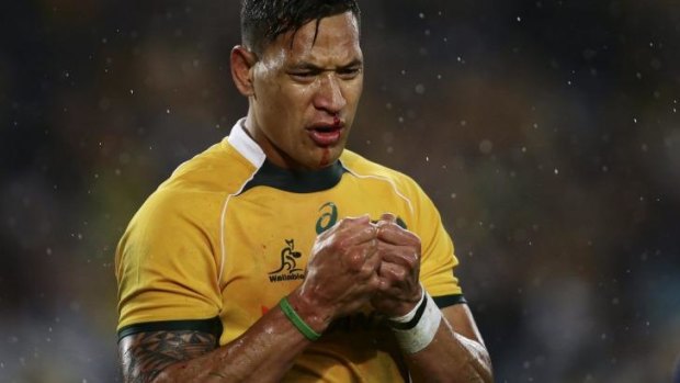 The claret flowed: Israel Folau feels the pain against the All Blacks in Sydney last month.