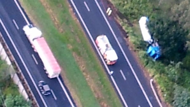 A truck roll-over blocks traffic on the Warrego Highway.