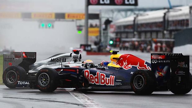 Crash ...  Lewis Hamilton, left, hits Mark Webber.