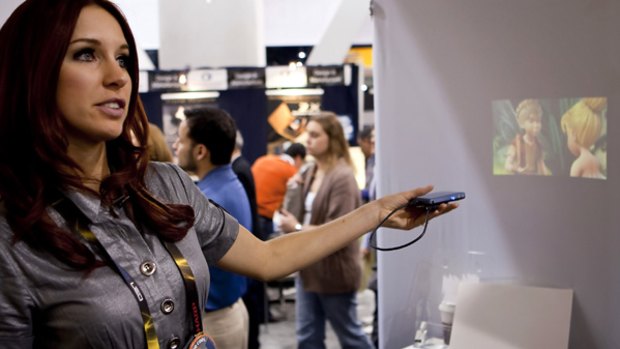 A Microvision laser pico projector being demonstrated at the Consumer Electronics Show.