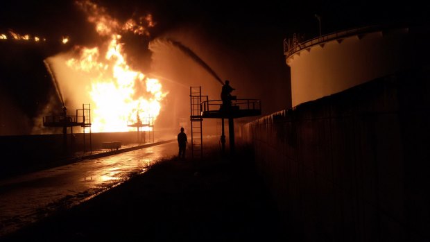 State-owned National Oil Corp has warned of a humanitarian and environmental catastrophe after the tank containing six million litres of fuel was set ablaze by rocket fire.
