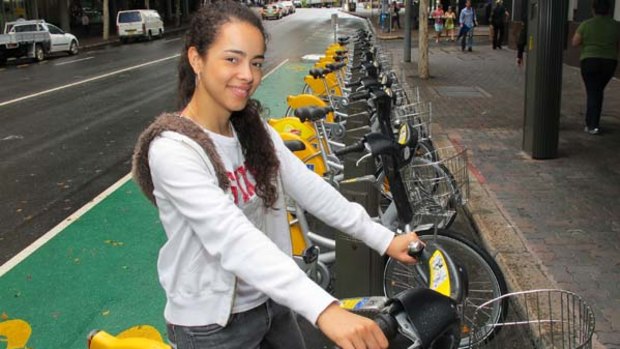 Student Maria Paulini tries one of Brisbane's new hire bikes in Queen Street.