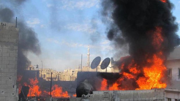 A fire on the roof of a building in the Baba Amor neighborhoud of the flashpoint city of Homs.