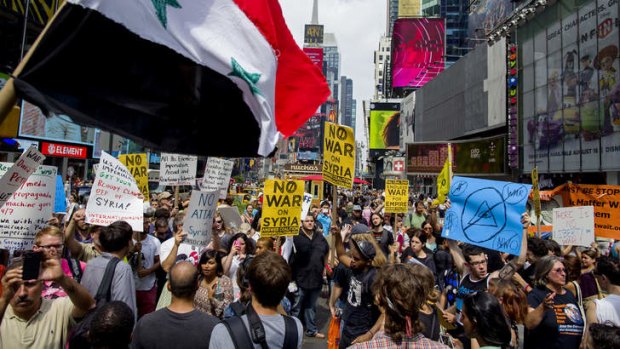 Message to Congress: Opponents of US military action in Syria demonstrate at New York's Times Square on Saturday.