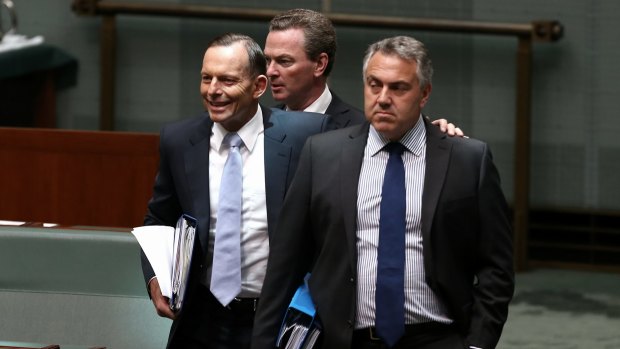 Budget warning: Tony Abbott, Christopher Pyne and Joe Hockey arrive at question time on Wednesday.