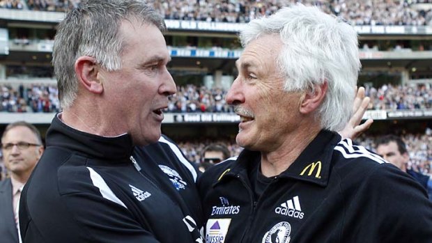 2008: Magpies football manager Geoff Walsh (left) and coach Mick Malthouse embrace after Collingwood won their first premiership in 20 years.