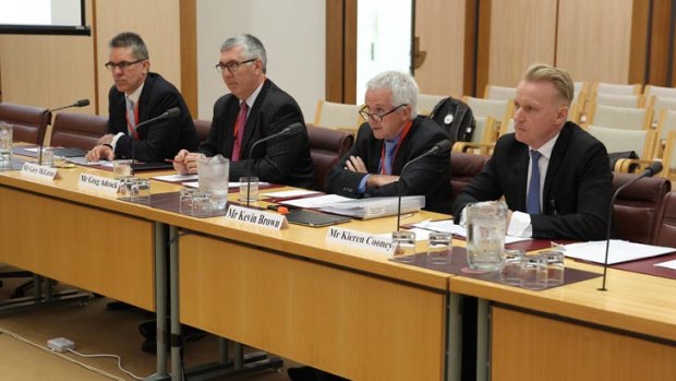 Gary McLaren, Greg Adcock, Kevin Brown and Kieren Cooney from NBN Co appear before a Senate hearing at Parliament House in 2013.