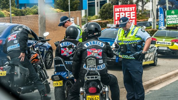 ACT Policing make their presence felt in Wollongong street Fyshwick, the home of the Rebels bikie clubhouse.