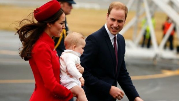 Prince George is escorted by his parents upon arrival in Wellington, New Zealand.