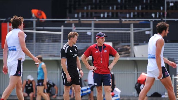 In the middle: Nathan Buckley (left) and Mark Neeld oversee practice.