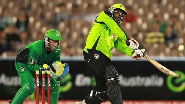 Big shot: Chris Gayle of the Sydney Thunder lashes out on the way to 65 off 43 balls at the MCG.