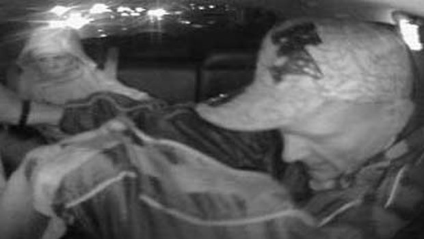 Security camera footage of two people police want to talk to over a late-night attack on a taxi driver.