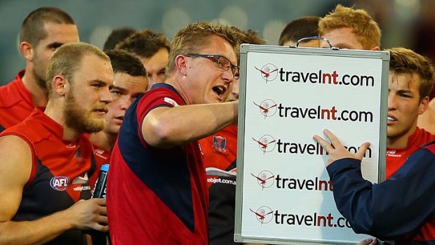 Mark Neeld instructs his players.