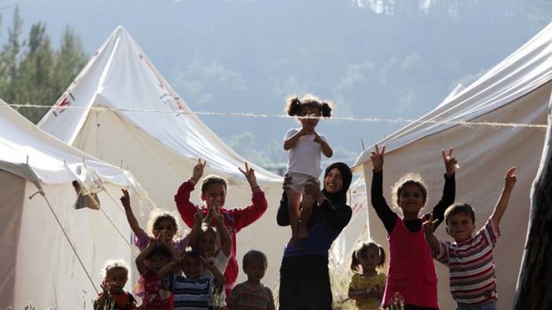 Syrian refugees at a border town in Turkey after fleeing violence at home.