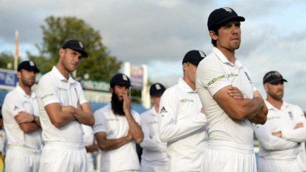 England's captain Alastair Cook and his teammates look on at the presentations after Sri Lanka won the second cricket Test match at Headingley
