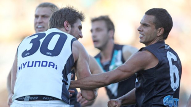 Testing times .... Carlton's Jarrad Waite and Port Adelaide's Danyle Pearce get physical.