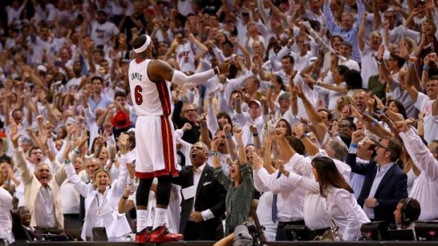 Fan favourite: LeBron James reacts after the final siren in Miami's game five win over Brooklyn in the second round of the NBA playoffs.