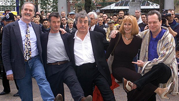 Monty Python actors, left to right, John Cleese, Michael Palin, Terry Jones, Carol Cleveland and Terry Gillam, pose for photographers before watching a repeat of their film 'The Life of Brian' in 1999.