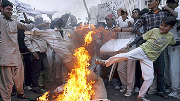 Pakistan fans burn cricket effigies after humiliating loss to Australia at Perth's WACA on Friday.