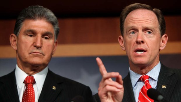Agreement ... Republican Senator Pat Toomey and Democrat Joe Manchin reached a compromise on background checks.