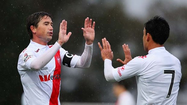 New man: Harry Kewell (left) turns out for Heart.